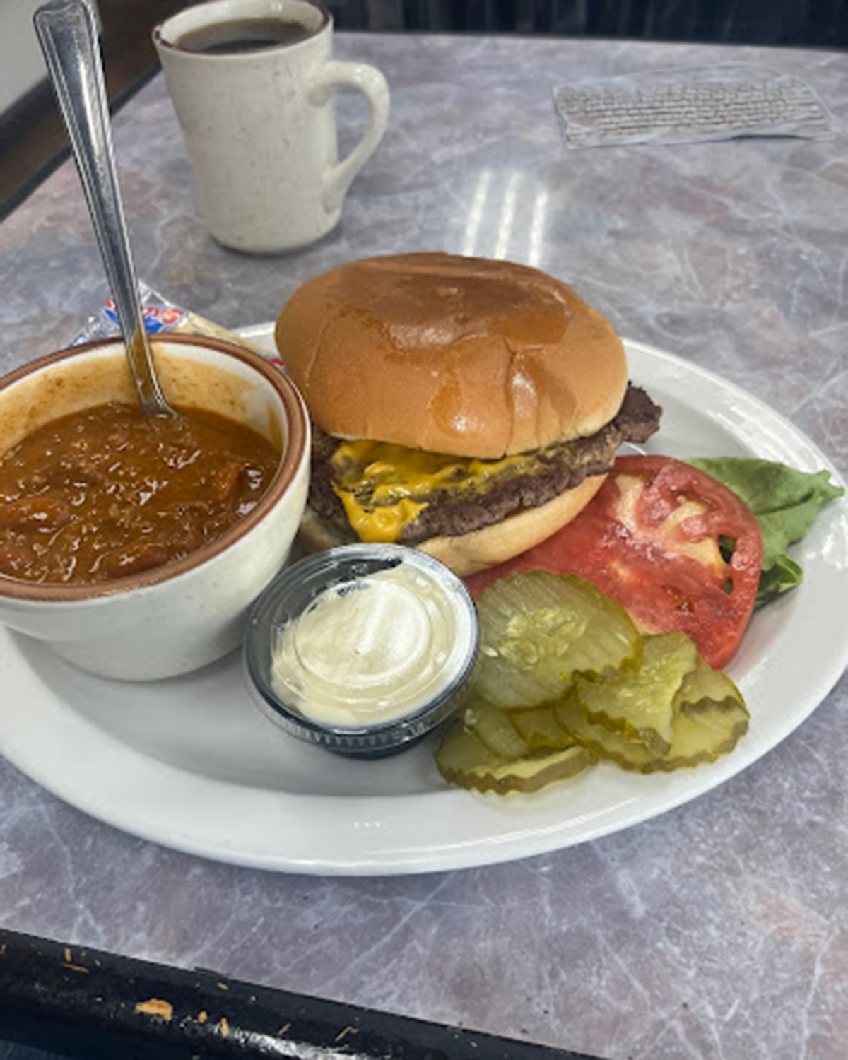A handmade burger and cup of chili from Cranberries Family Restaurant