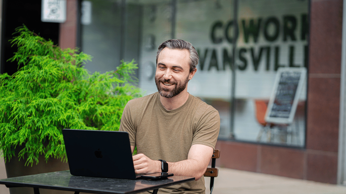 A man sits in downtown Evansville enjoying a high quality of life with many professional job opportunities in the Evansville Region