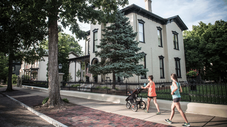walking in front of houses downtown