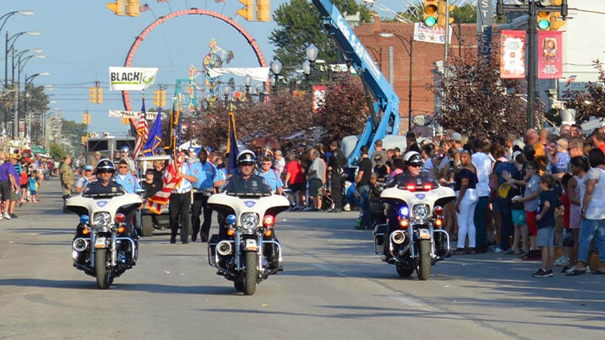 Police motorcycles lead a parade during the West Side Nut Club Fall Festival in Evansville, IN