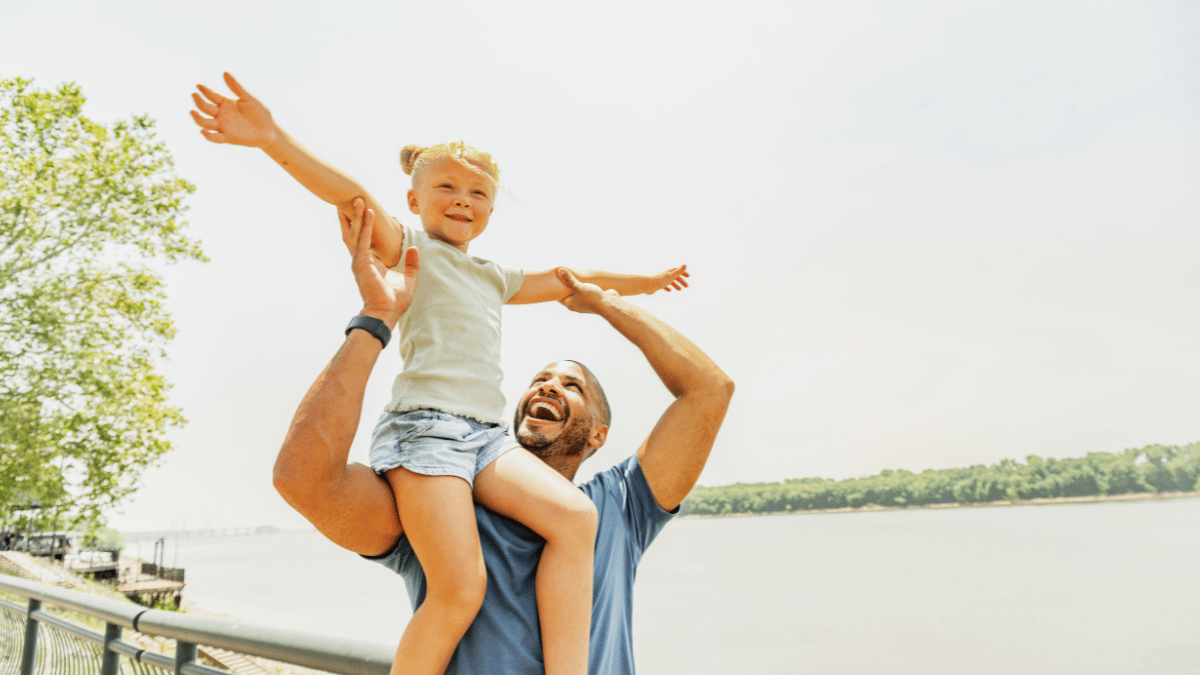 dad and daughter on riverfront