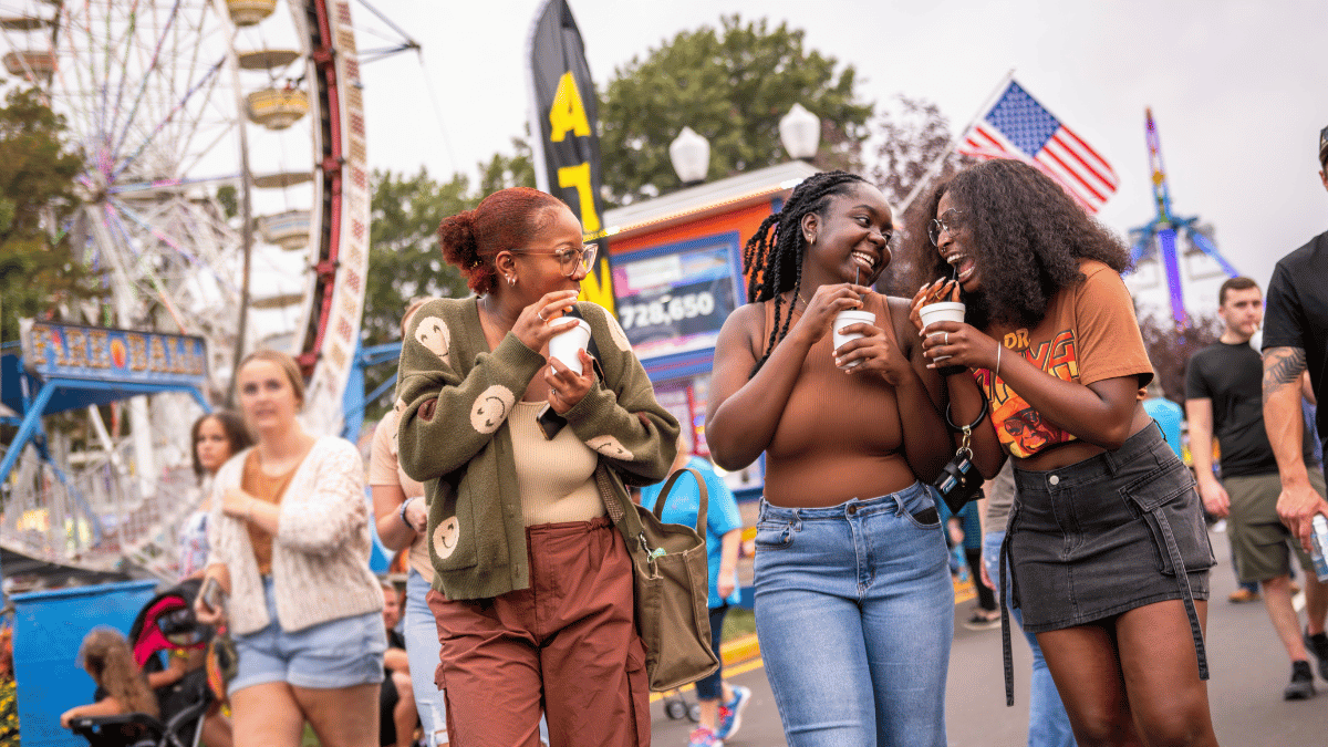 three women walking at fall fest