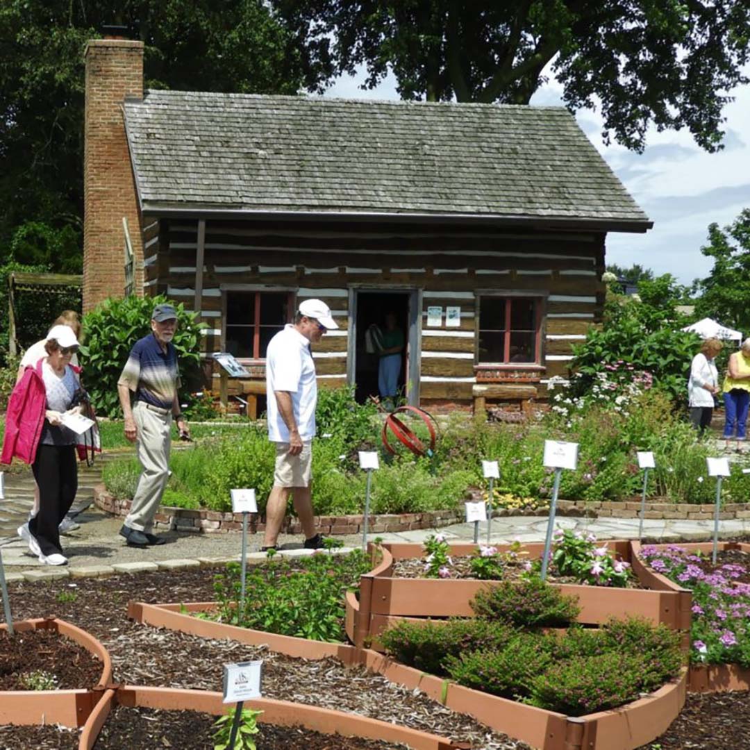 An image of a group touring the Master Gardener Display Garden in Evansville, IN